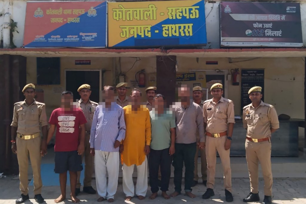 police and men in custody with their faces blurred. 