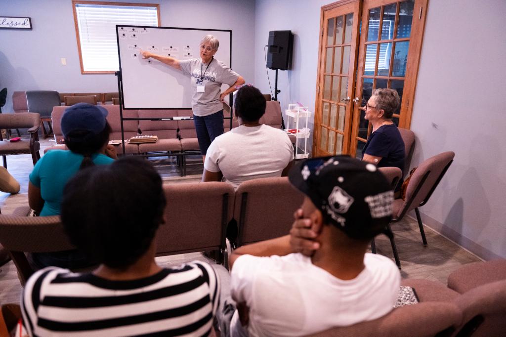 Volunteer teacher Hope Kaufman leads Haitian students during an English language class at the Haitian Community Help and Support Center in Springfield, Ohio, on September 13, 2024