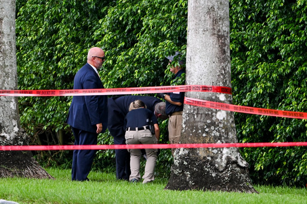 Law enforcement officials at the crime scene where Routh was positioned on the edge of Trump's West Palm Beach golf course.