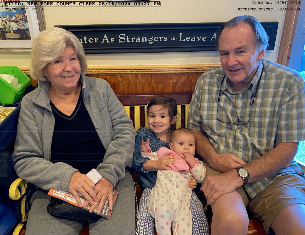 Photo included in a lawsuit filed by Nancy and John Galloway, sitting with their two granddaughters.