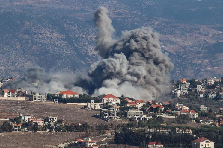 Smoke rising from a destroyed building in the southern Lebanese village of Khiam due to an Israeli airstrike on September 25, 2024.