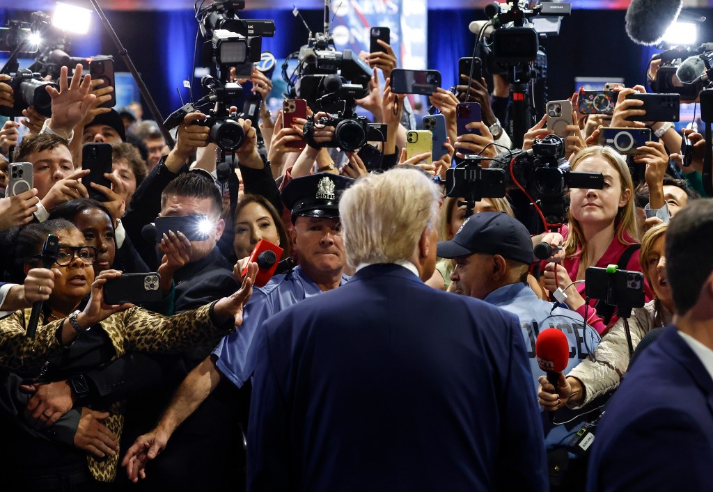 Donald Trump speaks to reporters in the spin room after debating Democratic presidential nominee Kamala Harris.