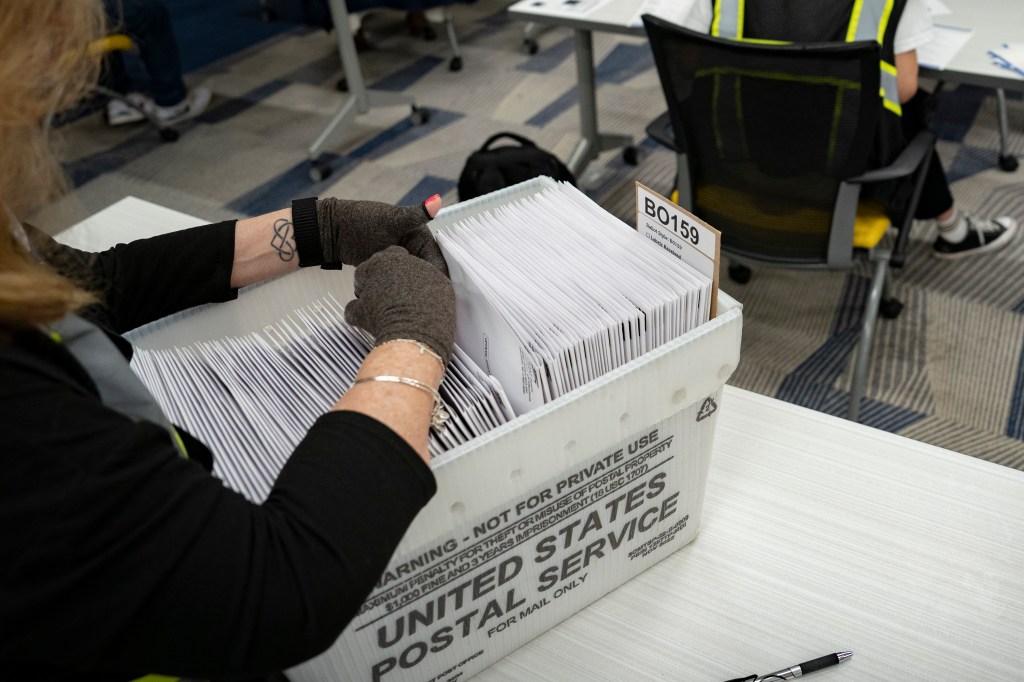 Absentee ballots are prepared to be mailed at the Wake County Board of Elections 