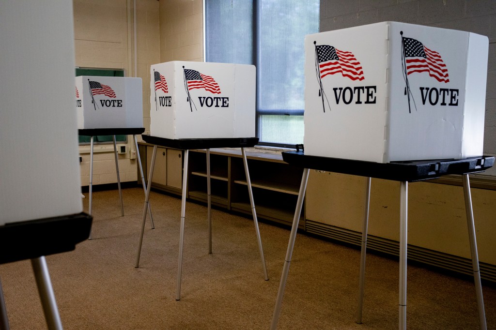 Voting booths lined up at a polling station in Lansing, Michigan, on August 1, 2024, following approval of new Senate district maps by federal judges.