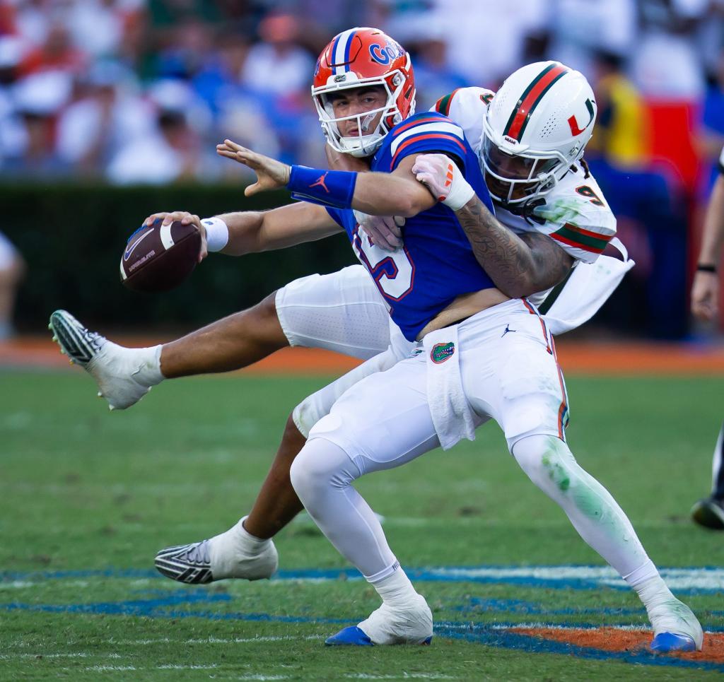 Miami Hurricanes defensive lineman Tyler Baron (9) sacks Florida Gators quarterback Graham Mertz (15) during the season opener at Ben Hill Griffin Stadium in Gainesville, FL on Saturday, August 31.