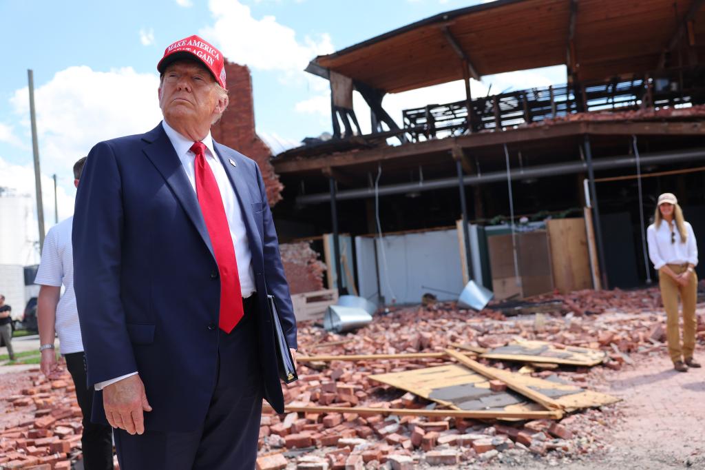 Republican presidential nominee, former U.S. President Donald Trump, listens to a question as he visits Chez What Furniture Store which was damaged during Hurricane Helene on September 30, 2024 in Valdosta, Georgia.