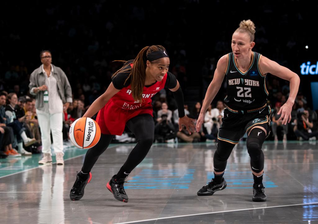 Jordin Canada #3 of the Atlanta Dream handles ball against Courtney Vandersloot #22 of the New York Liberty