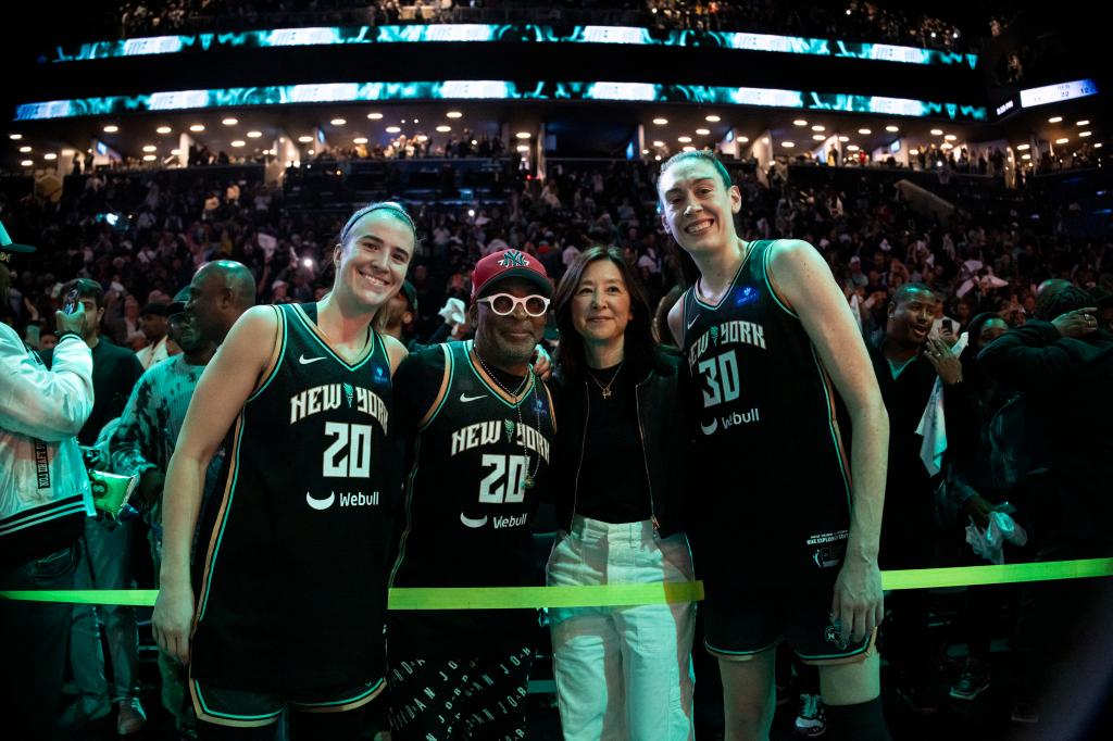 Spike Lee, Clara Wu Tsai along with Sabrina Ionescu #20 and Breanna Stewart #30 of the New York Liberty after win over against the Las Vegas Aces on Sept. 29, 2024.