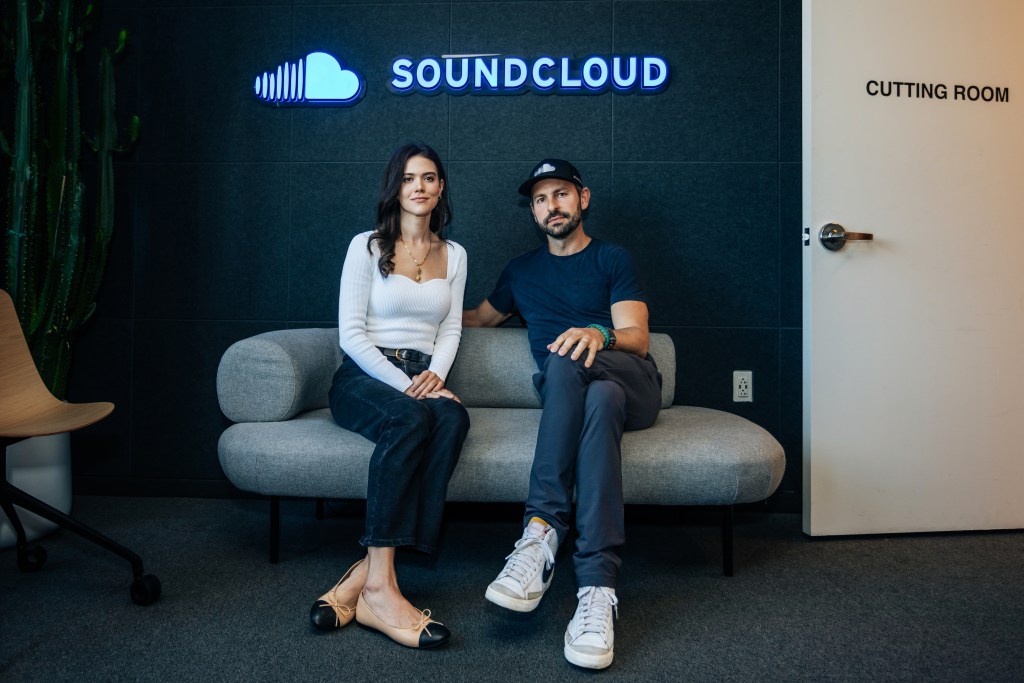 Lydia Moynihan and Eliah Seton sit on a couch at the SoundCloud offices. 