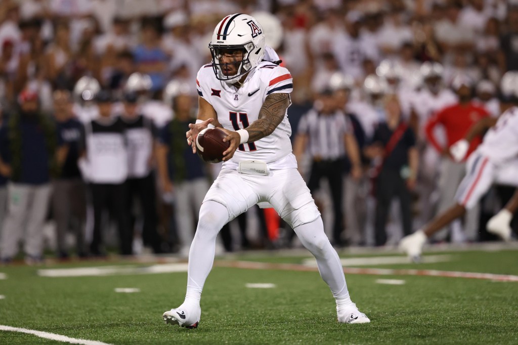 Quarterback Noah Fifita #11 of the Arizona Wildcats drops back to pass during the first half against the New Mexico Lobos at Arizona Stadium on August 31, 2024 in Tucson, Arizona.