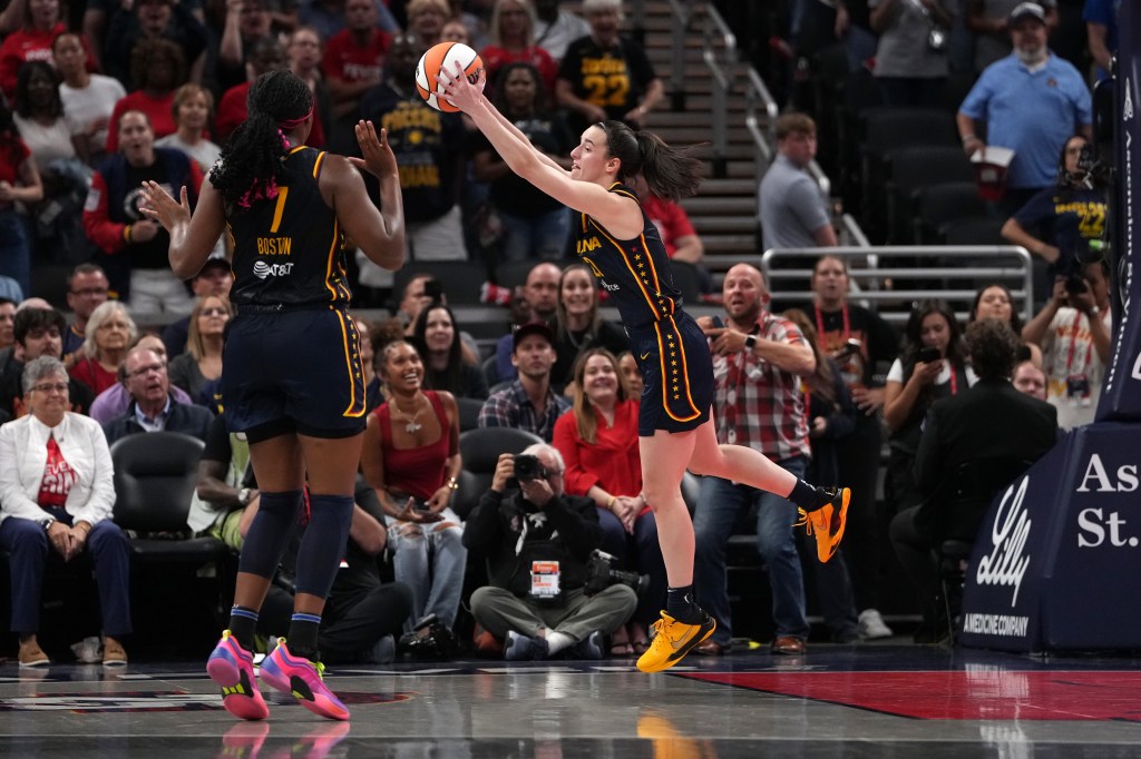 Caitlin Clark #22 of the Indiana Fever grabs a rebound in the fourth quarter against the Los Angeles Sparks at Gainbridge Fieldhouse on September 04, 2024 in Indianapolis, Indiana.