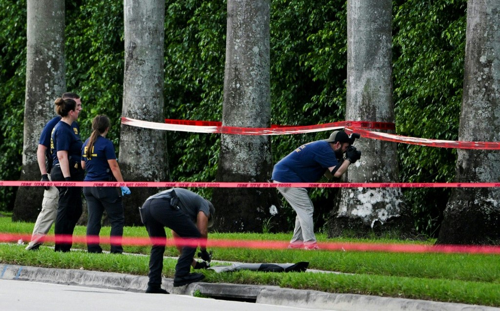 Members of FBI are seen at the crime scene outside the Trump International Golf Club in West Palm Beach, Florida, on September 15, 2024.