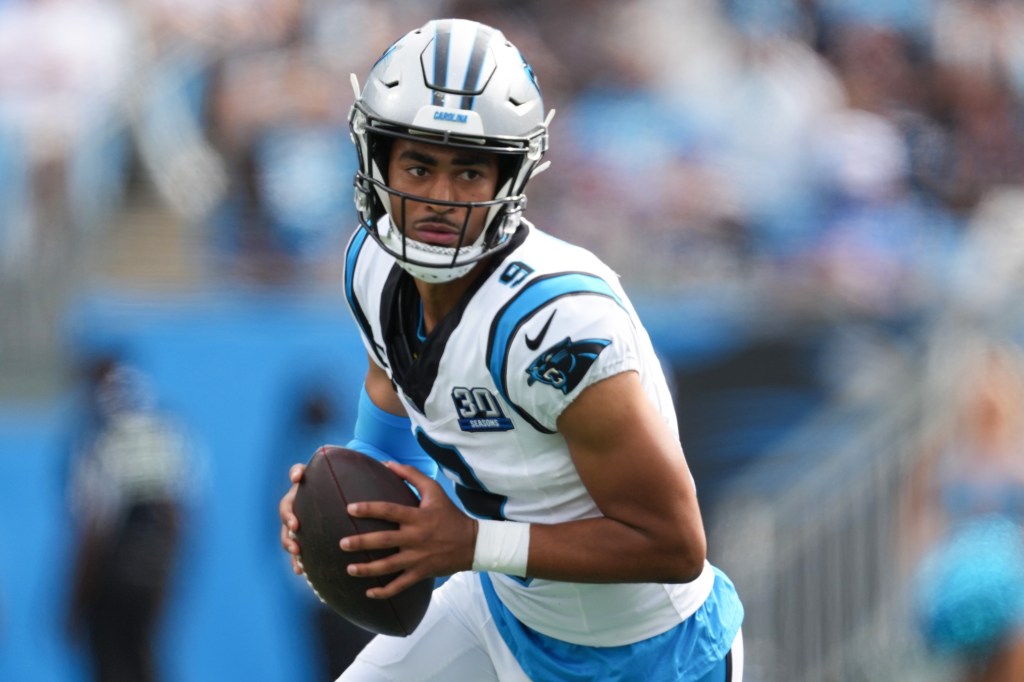 Bryce Young #9 of the Carolina Panthers looks to pass during the fourth quarter against the Los Angeles Chargers at Bank of America Stadium on September 15, 2024 in Charlotte, North Carolina.