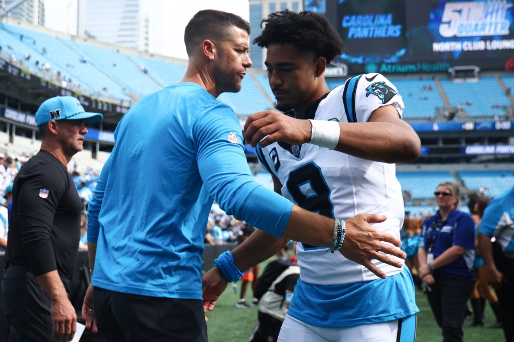 Head coach  
Dave Canales and quarterback Bryce Young #9 of the Carolina Panthers are seen after losing to the Los Angeles Chargers 26-3 at Bank of America Stadium on September 15, 2024 in Charlotte, North Carolina.