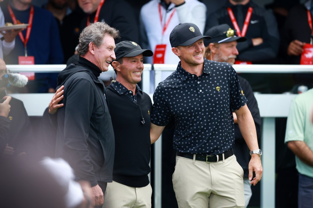 Wayne Gretzky, International Team Captain Mike Weir and Mackenzie Hughes of Canada pose for a photograph during Thursday's Four-ball matches on day one of the 2024 Presidents Cup at The Royal Montreal Golf Club on September 26, 2024 in Montreal, Quebec, Canada.