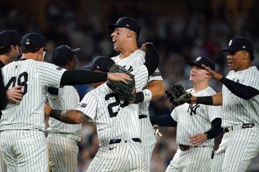 The New York Yankees celebrate a 10-1 win against the Baltimore Orioles at Yankee Stadium on September 26, 2024 in New York City