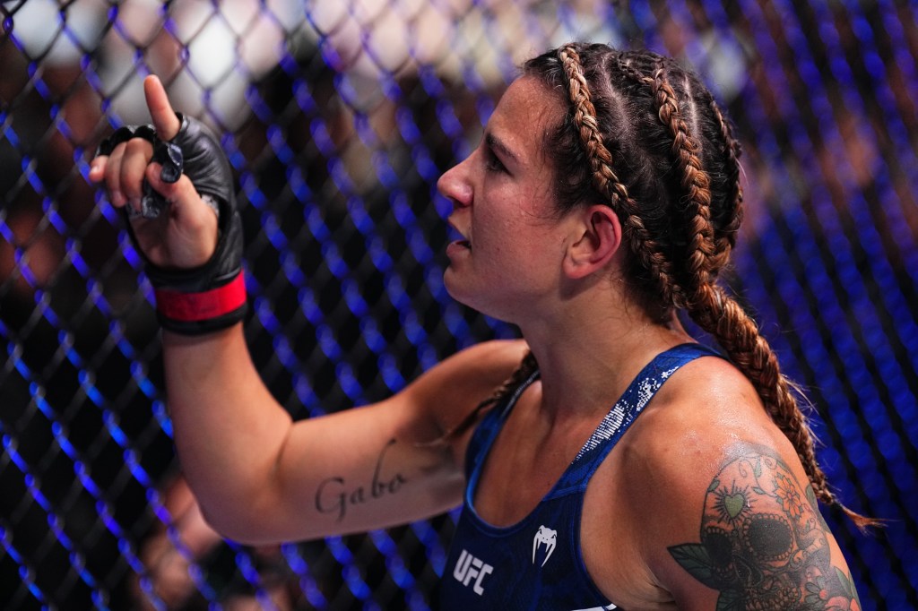 Ailin Perez of Argentina reacts after a submission victory against Daria Zhelezniakova of Russia in a bantamweight fight during the UFC Fight Night event at The Accor Arena on September 28, 2024 in Paris, France.  