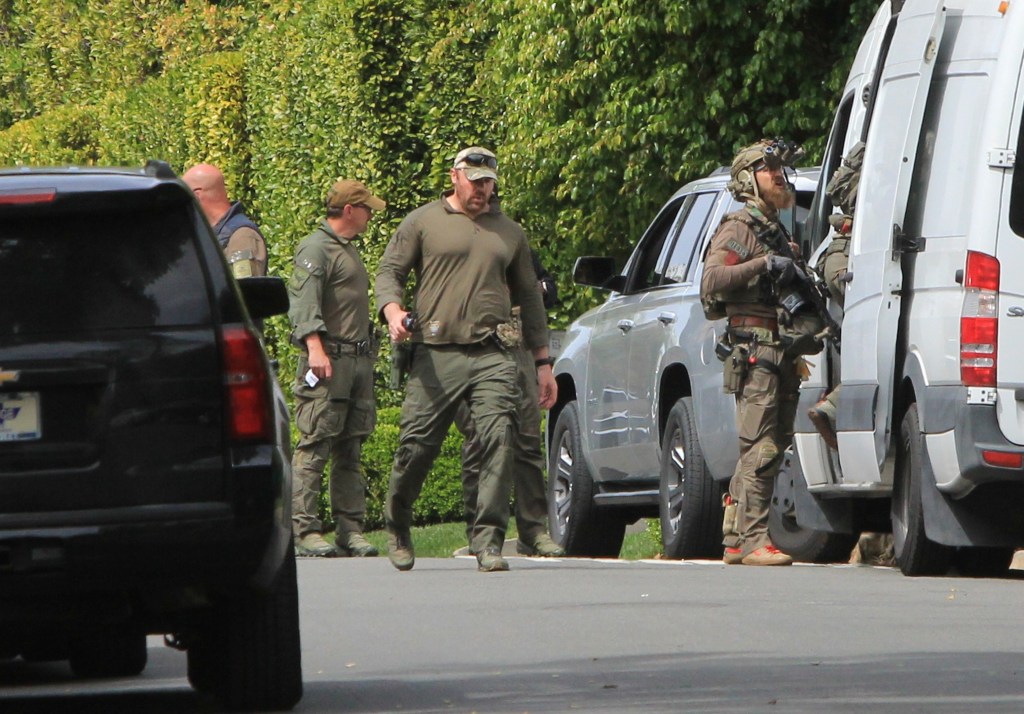 View of law enforcement agents and vehicles outside Diddy's Beverly Hills estate are seen on March 25, 2024 in Los Angeles, California.  