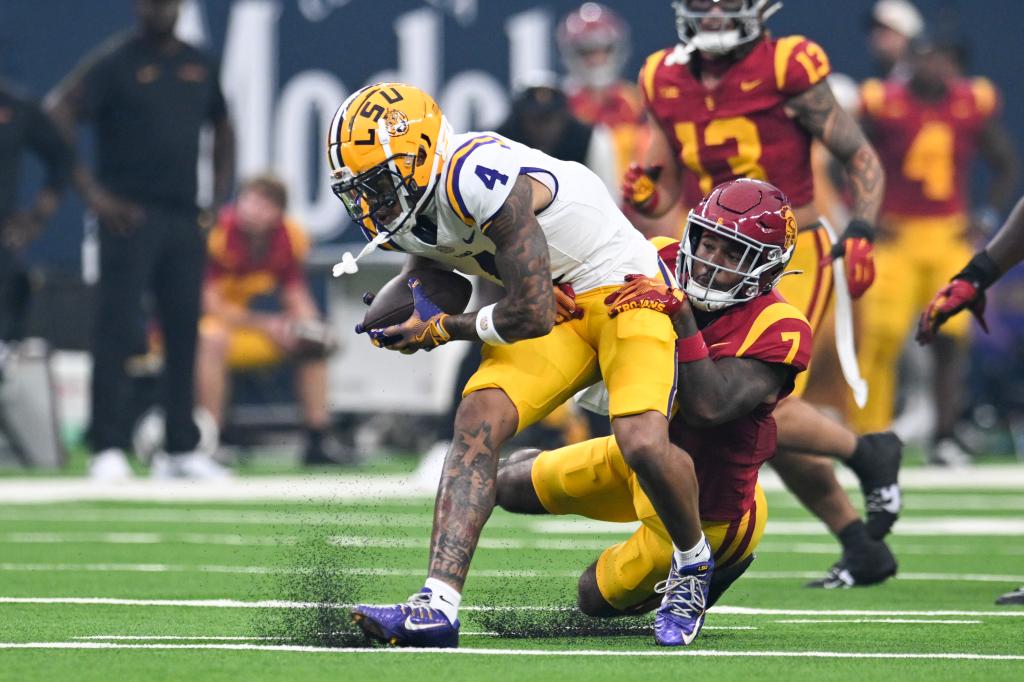 CJ Daniels #4 of the LSU Tigers is tackled by Kamari Ramsey #7 of the USC Trojans in the first quarter of the Vegas Kickoff Classic at Allegiant Stadium on September 01, 2024.