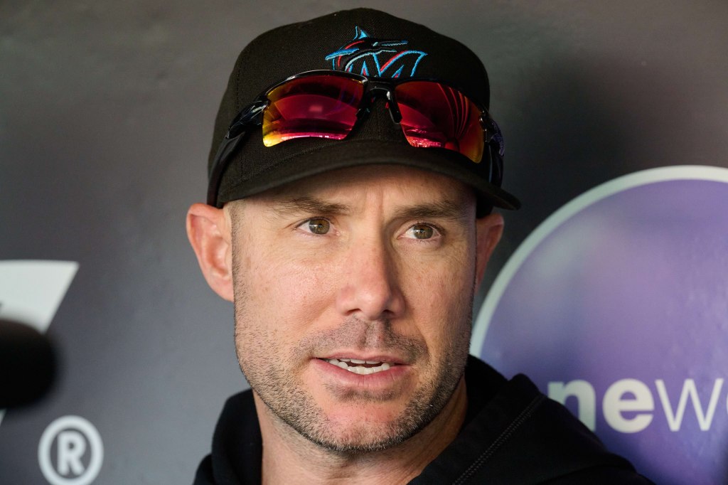 Miami Marlins manager Skip Schumaker (45) speaks with the media in the dugout before the game between the San Francisco Giants and the Miami Marlins at Oracle Park.