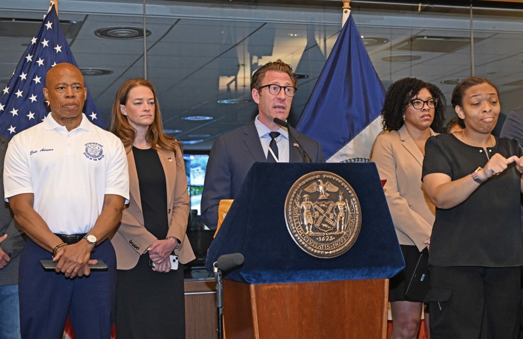 Zach Iscol addressing at a press conference about the upcoming heat wave in NYC, with Mayor Adams and other officials in the background