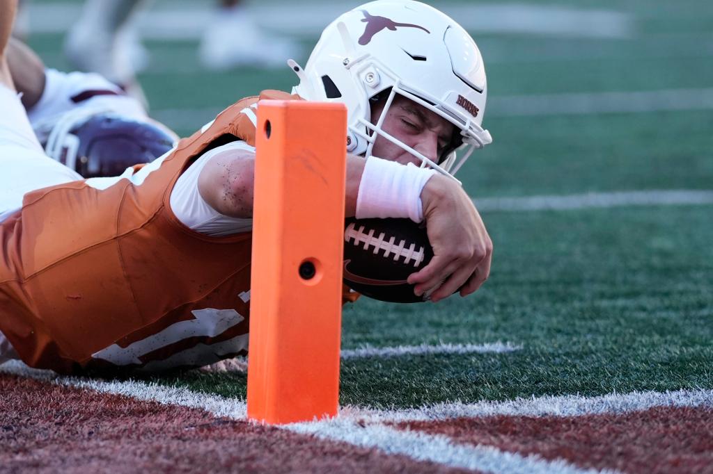 Arch Manning dives just short of the end zone during the second half of Texas' win.