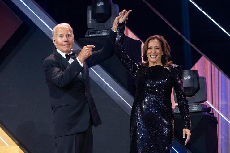 President Joe Biden welcomes Vice President and Democratic presidential candidate Kamala Harris to the stage during the 2024 Phoenix Awards Dinner at the Washington Convention Center in Washington, DC.