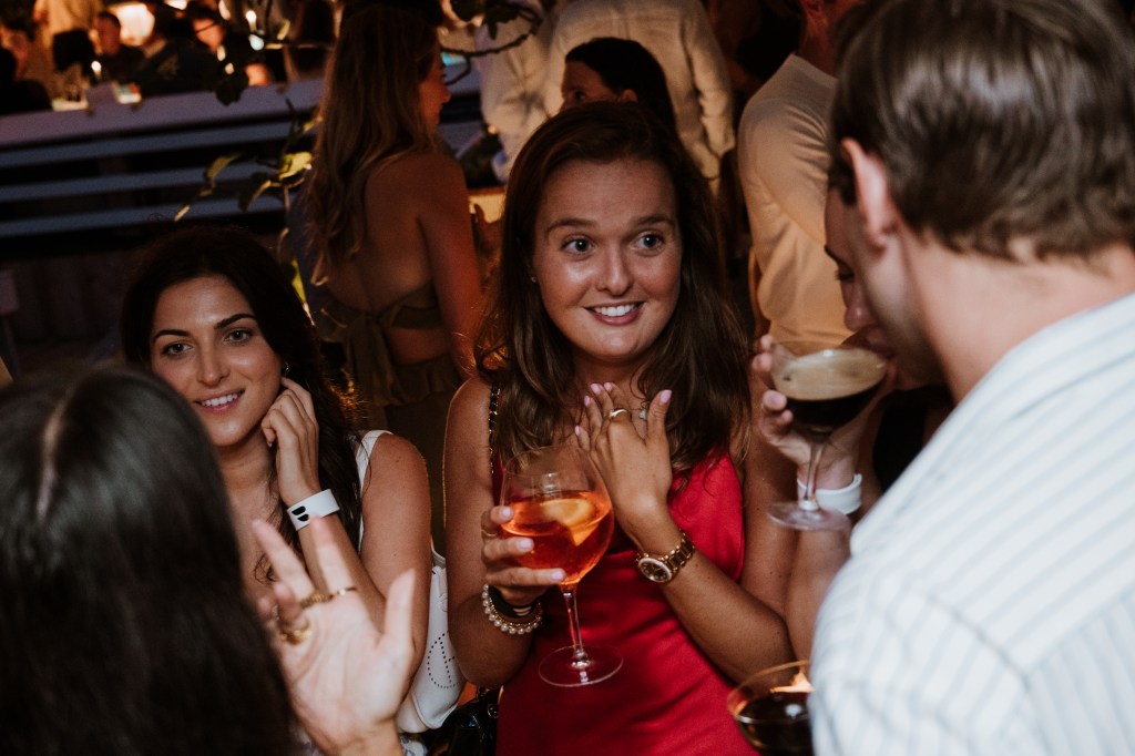 A group of people at an event hosted by The League, photographed by Margaryta Bushkin/Muccitas