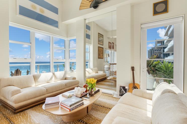 An ocean view from the large window in the colorful top-floor unit of a beach condo at 3739 Collins Avenue