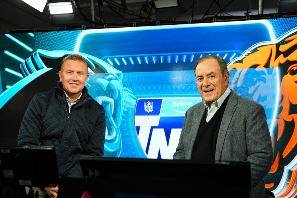 Kirk Herbstreit and Al Michaels in the Amazon Prime Thursday Night Football broadcast booth before Carolina Panthers versus Chicago Bears game at Soldier Field