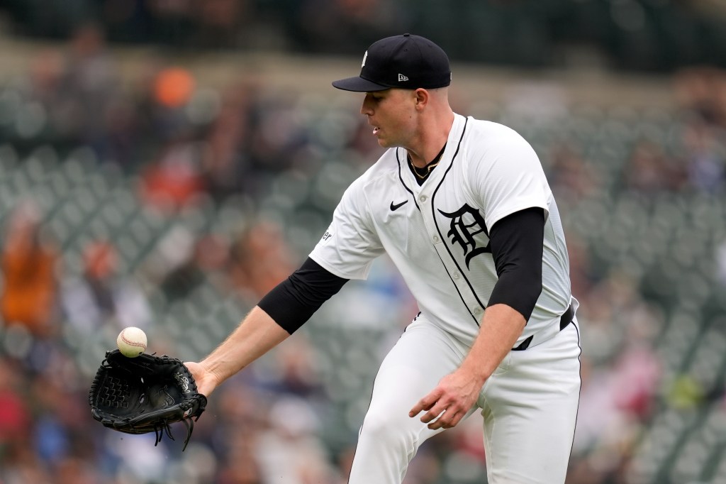 Detroit Tigers pitcher Tarik Skubal (29) bobbles a ground ball from Tampa Bay Rays' Brandon Lowe in the sixth inning of a baseball game, Tuesday, Sept. 24, 2024, in Detroit. Skubal threw to first base for the out.