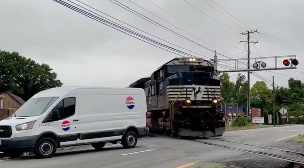 The van then crosses over the tracks, narrowly avoiding being turned into twisted metal by the train.