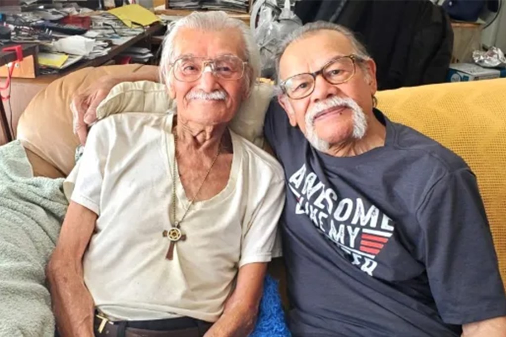 Two brothers sitting on a couch, with Roger on the left, during one of their last meetings before his passing