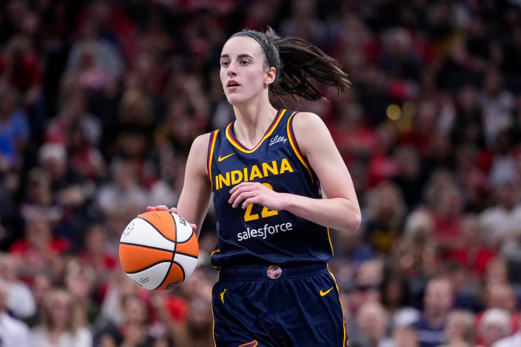 Indiana Fever guard Caitlin Clark (22) plays against the Los Angeles Sparks in the second half of a WNBA basketball game in Indianapolis, Wednesday, Sept. 4, 2024.