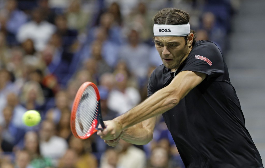 Taylor Fritz hits a backhand during his U.S. Open semifinal win over Frances Tiafoe.