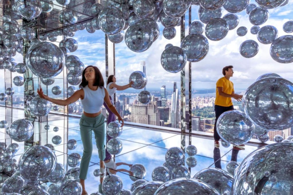 People enjoying a art exhibit in New York.