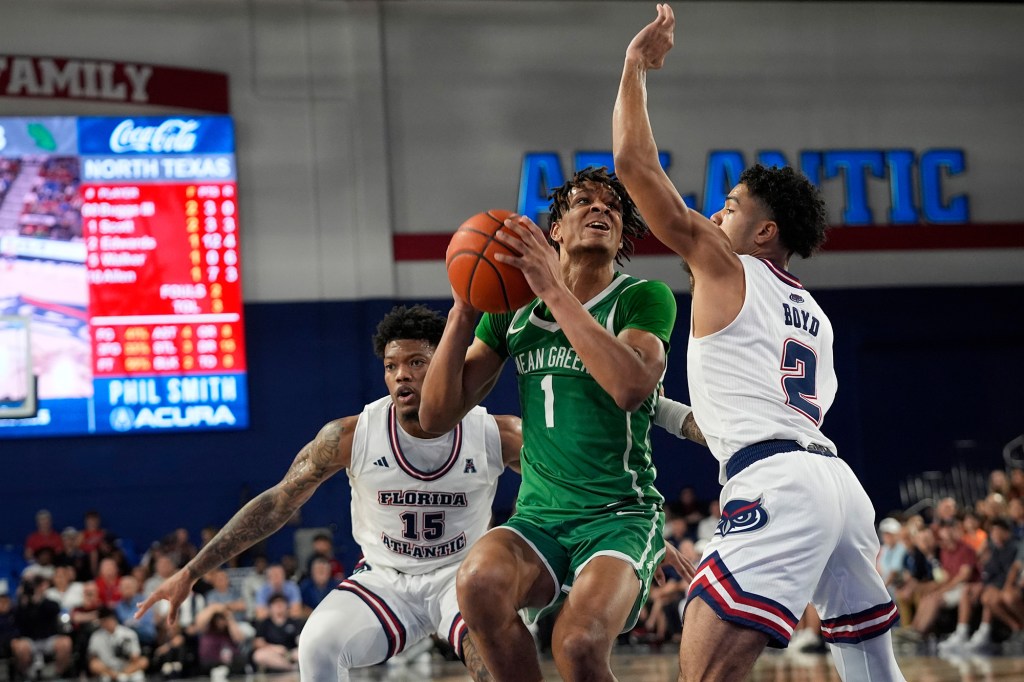 Aaron Scott looks to attempt a shot during a North Texas game last season.