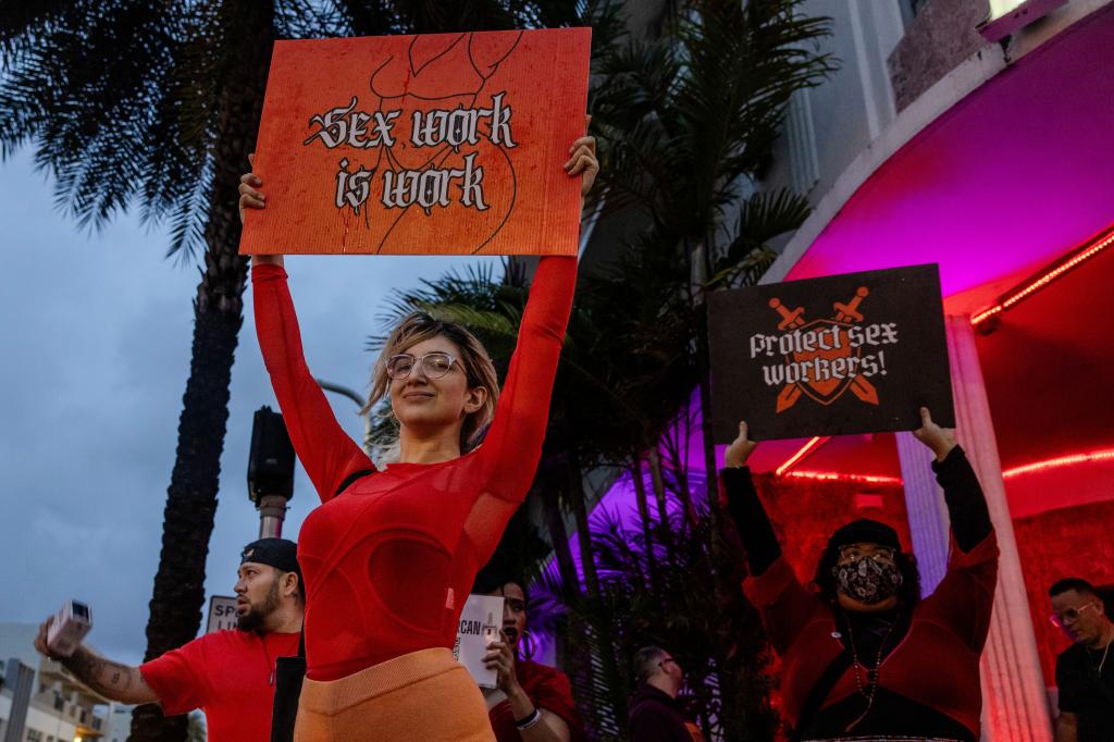 Activists and sex workers demonstrate during the 4th annual "Slut Walk" Miami bringing awareness surrounding sex worker rights in Miami Beach, Florida on December 16, 2023