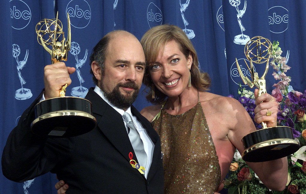 Allison Janney and Richard Schiff pose after winning a trophy for "Supporting Actor and Actress in a Drama Series" for their role in "The West Wing" during the 52nd Annual Primetime Emmy Awards at the Shrine Auditorium in Los Angeles 10 September, 2000.