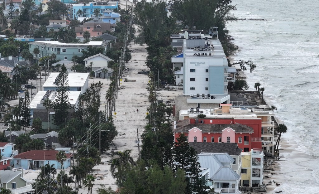 Aerial view of sand and debris covering roads in Treasure Island, Florida after Hurricane Helene