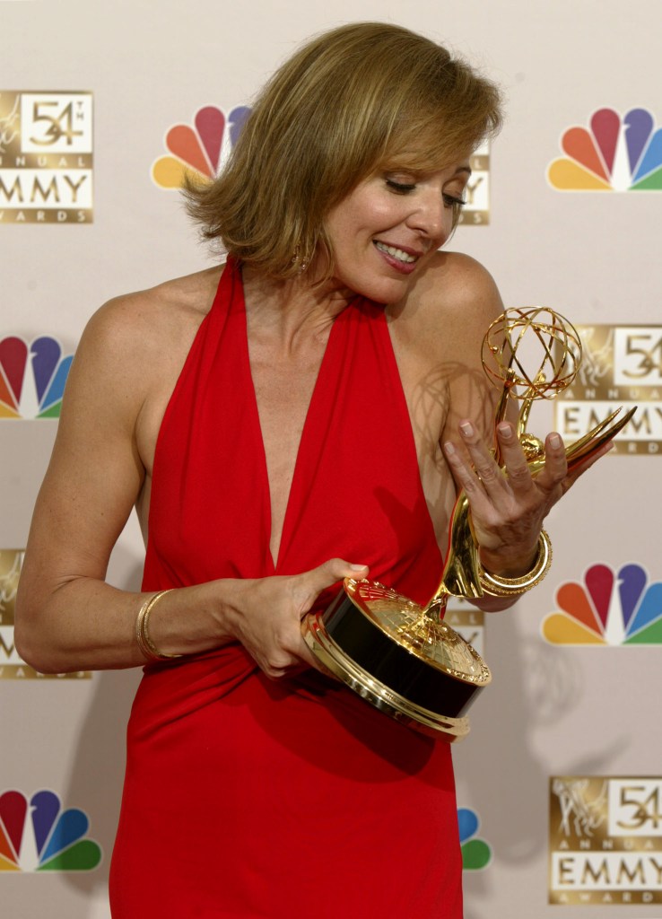 Allison Janney cradles her Lead Actress in a Drama Series Emmy at the 54th annual Emmy Awards in Los Angles September 22, 2002. 