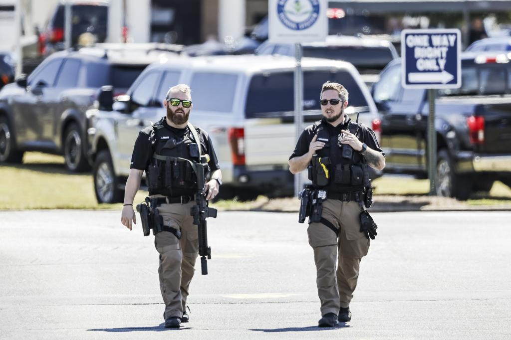 Law enforcement officers seen outside the school.