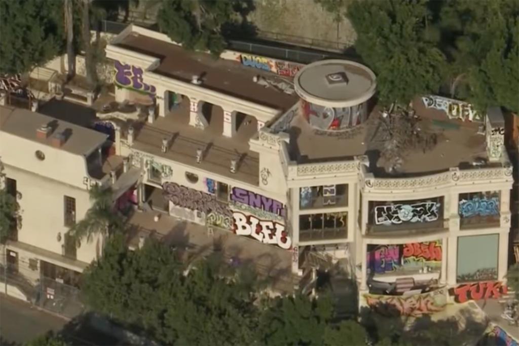 A second California mansion owned and abandoned by John Powers Middleton is blanketed with graffiti. 