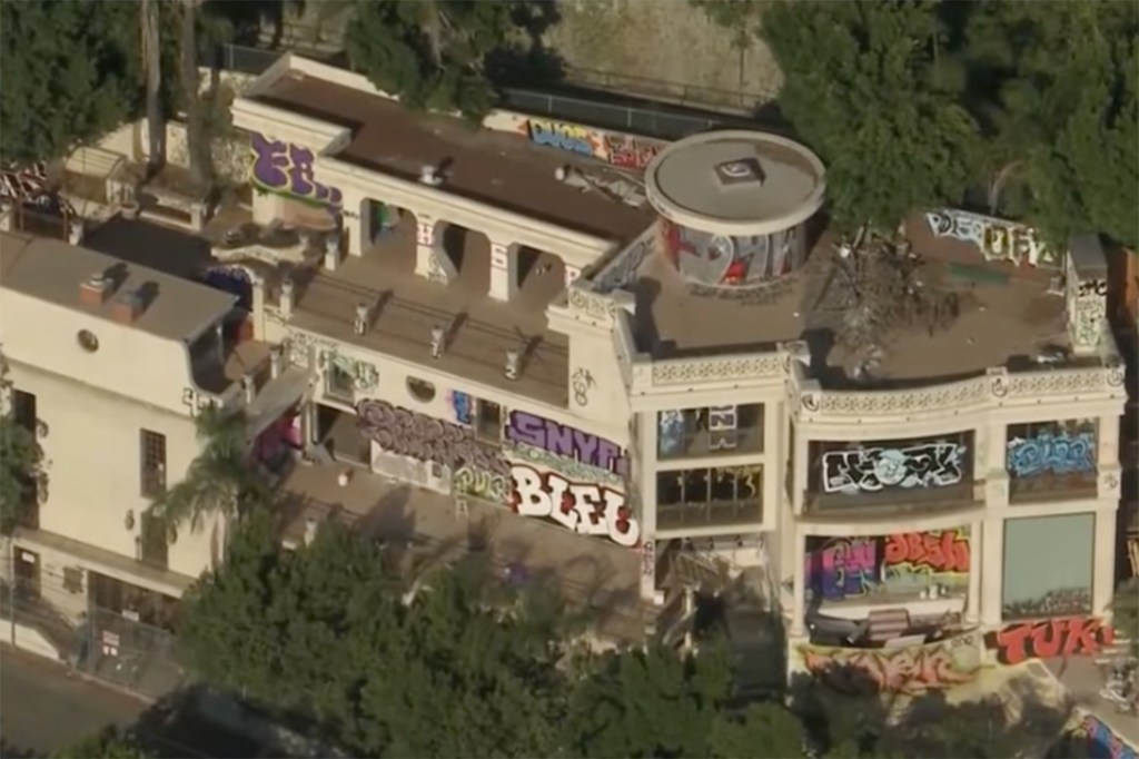 A second California mansion owned and abandoned by John Powers Middleton is blanketed with graffiti. 