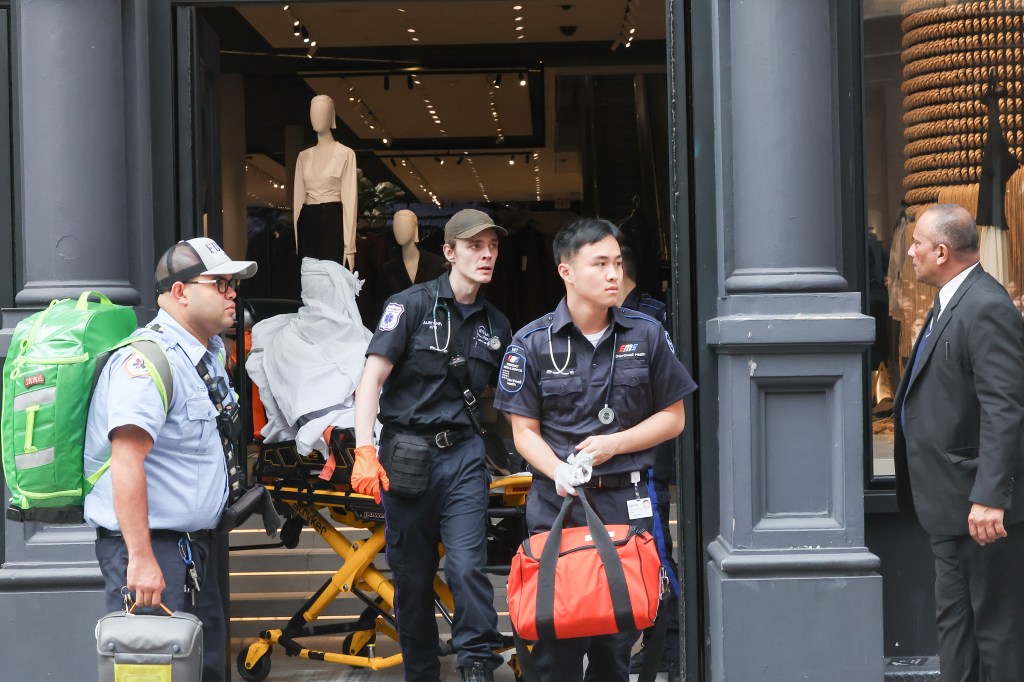 A photo of medical personnel transporting an assault victim from Zara.