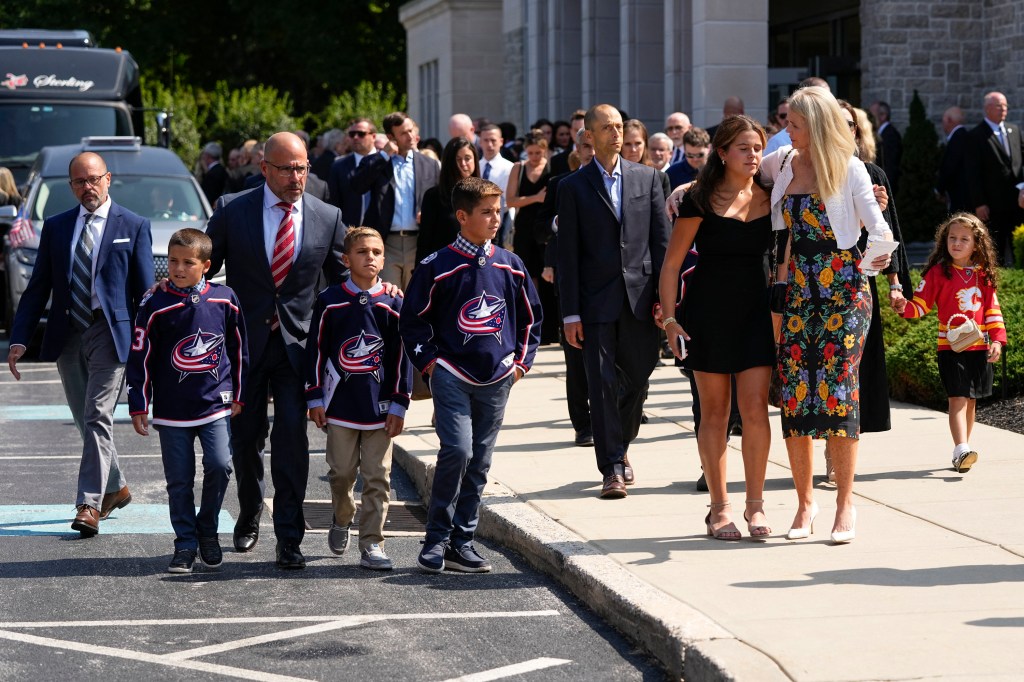 Attendees were seen leaving the church after the funeral service.
