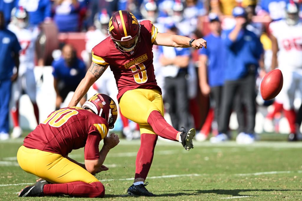 Austin Seibert #3 of the Washington Commanders kicks a field goal during the fourth quarterto tie the game against the New York Giants at Northwest Stadium on September 15, 2024 in Landover, Maryland. 