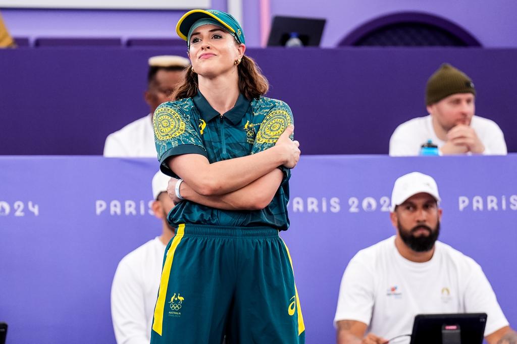 B-Girl Raygun of Team Australia in green and yellow uniform, crossing her arms, ready to compete in the B-Girls Round Robin at Olympic Games Paris 2024