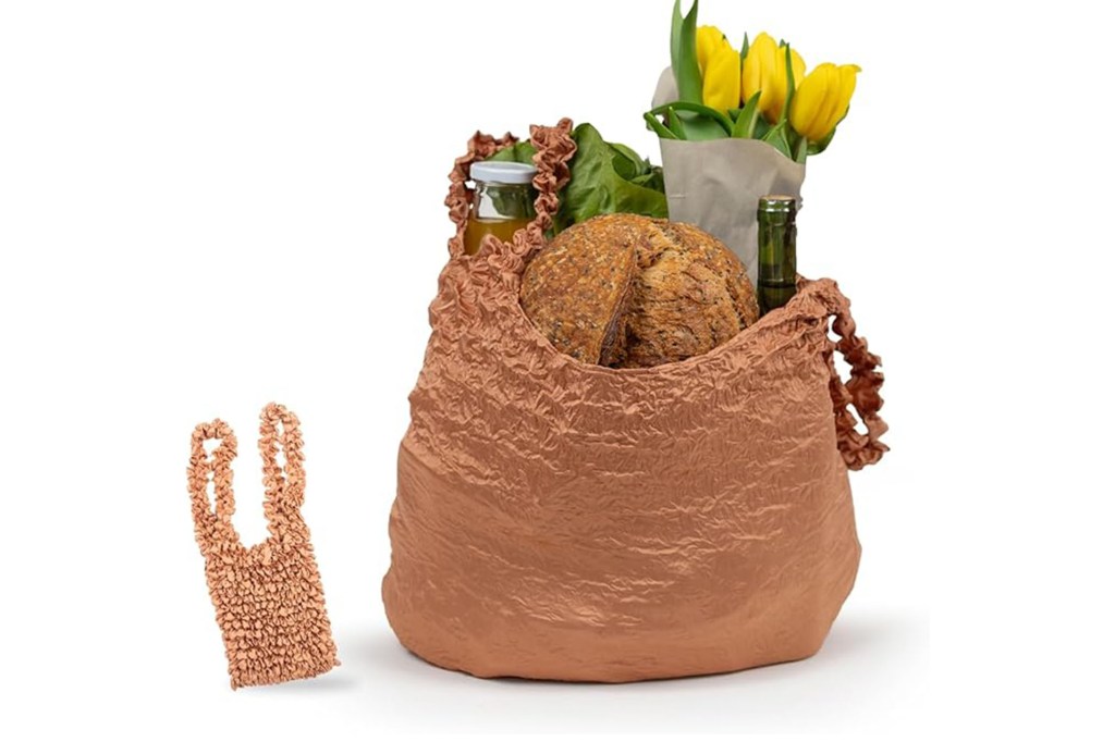 A bag filled with food and flowers