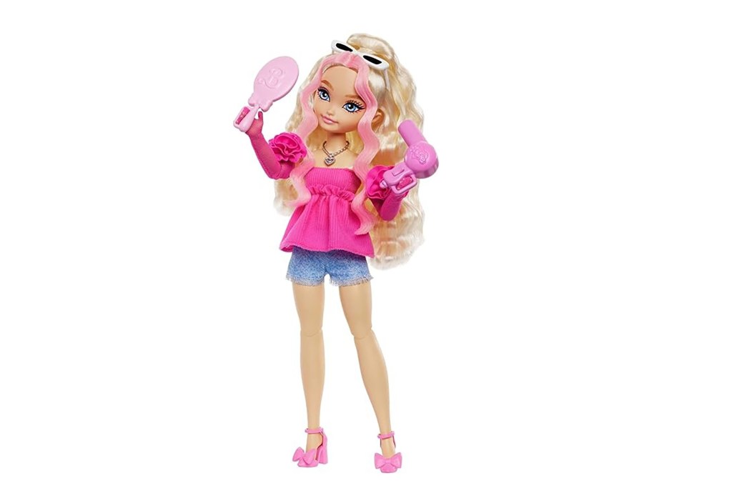 A blonde Barbie doll in pink attire holding a mirror